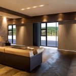 Vertical room-darkening cellular shades on doors